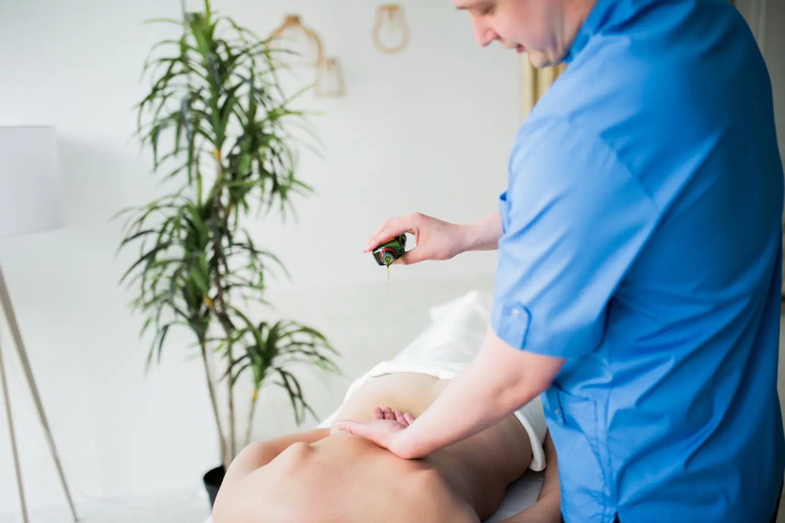 Calm massage treatment using oil in a professional treatment room